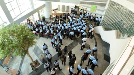 Dozens of police officers carried out a raid on the Apple Daily office in June 2021.