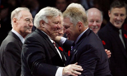 Bobby Hull, left, embraces his son Brett during an on-ice ceremony to introduce the 2009 Hockey Hall of Fame inductees.