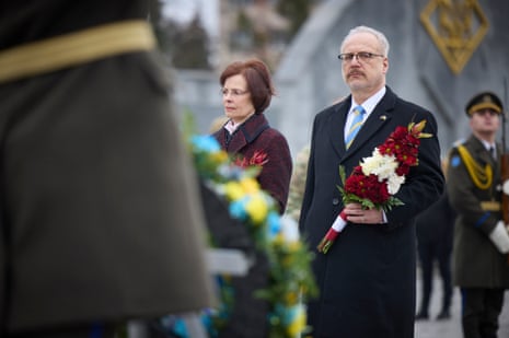 Latvia’s president, Egils Levits, and his wife, Andra Levite, attending a ceremony to pay tribute to fallen Ukrainian service members at a military cemetery in Lviv.