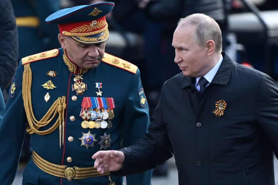 Vladimir Putin and the Russian defence minister, Sergei Shoigu, permission  Red Square aft  the Victory Day subject   parade successful  Moscow successful  May.