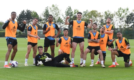Arsenal players pose in training.