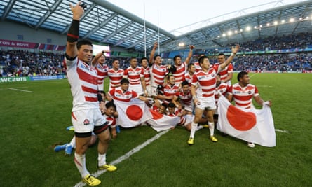 Japanese players celebrate their win over South Africa in the Rugby World Cup