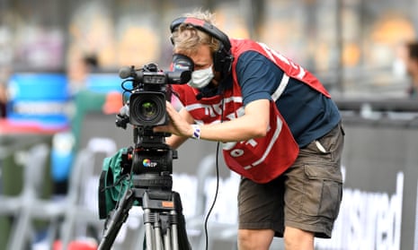 A Foxtel camera man during an AFL match between the Brisbane Lions and the Fremantle Dockers at the Gabba in 2020.
