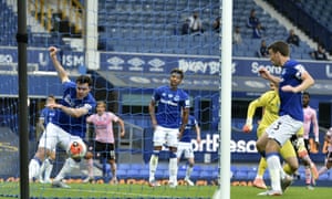 Everton’s Michael Keane clears off the line.