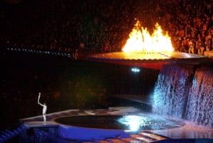 Cathy Freeman, the final bearer of the Olympic torch, gesturing after lighting the cauldron at the Olympic Stadium in Sydney.