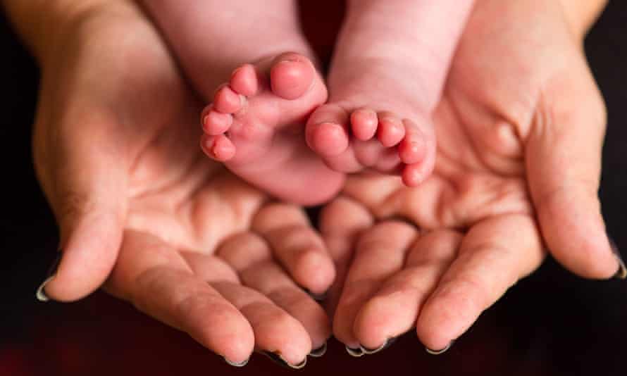 Freezing embryos study<br>Embargoed to 2330 Wednesday August 05 File photo dated 23/01/16 of a mother holding the feet of a new baby. IVF clinics should avoid "freeze-all" strategies, researchers have said after a study found that freezing embryos for later transfer does not result in a higher chance of pregnancy. PA Photo. Issue date: Wednesday August 5, 2020. Research published in The BMJ found that the chances of pregnancy are no higher among women who have a frozen embryo transfer over a fresh one. See PA story HEALTH Embryos. Photo credit should read: Dominic Lipinski/PA Wire