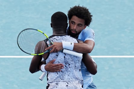 Arthur Fils (right) embraces Frances Tiafoe at the net after their three-set final.