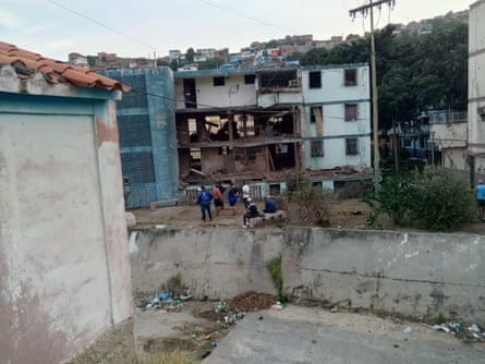 A three-storey residential block with the facade of two floors blown off