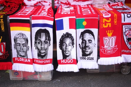 Scarves bearing the faces of Liverpool’s new signings Florian Wirtz, Jeremie Frimpong and Hugo Ekitike alongside the late Diogo Jota are seen for sale ahead of the pre-season friendly against Athletic Club