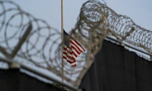 A flag flies at half-mast in honour of the victims of a terrorist attack in Kabul, Afghanistan, as seen from Camp Justice in Guantánamo Bay Naval Base, Cuba.