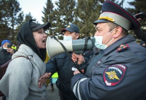 A woman confronts a police officer at a protest in support of jailed opposition leader Alexei Navalny in Ulan-Ude, the regional capital of Buryatia, Siberia.