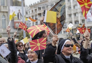 Skopje, MacedoniaNuns wave flags to salute Pope Francis on his first ever visit, as he arrives to celebrate Mass in Macedonia Square