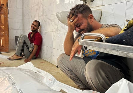 Palestinians mourn their loved ones at Nasser hospital on Thursday after an Israeli attack on a food aid point in Khan Younis.