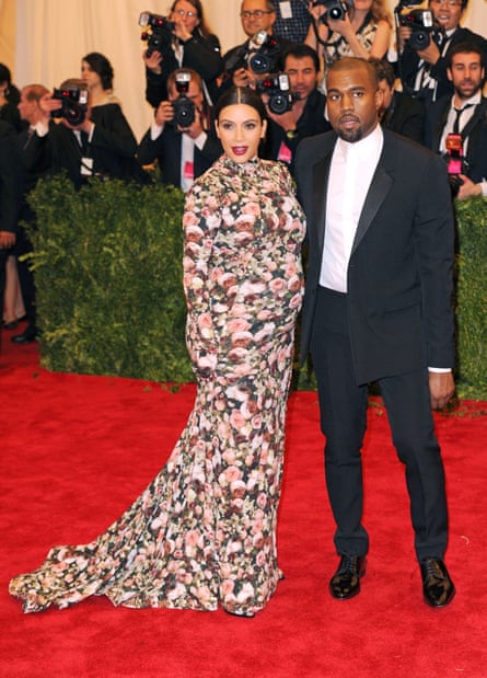 ‘Dressed as a sofa’ ... seven months pregnant in Givenchy – with Kanye in 2013.