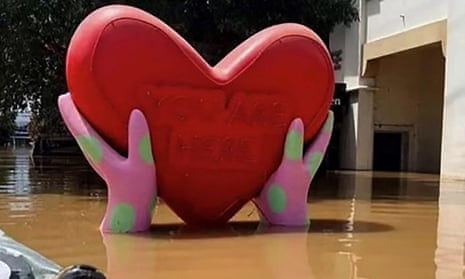 Love heart statue submerged in water in Lismore during the floods