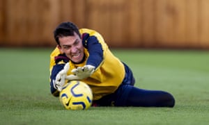 Lovre Kalinic dives to make a save during Aston Villa training.