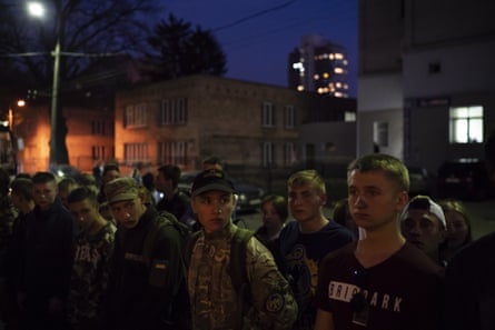 Members the youth wing of the nationalist Svoboda party stand in formation after a concert in Kiev