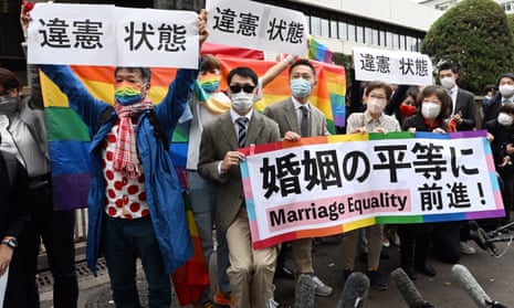 Protesters outside a court in Tokyo, which rejected a claim for damages by same-sex couples in November 2022.