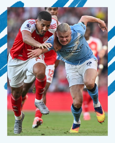 Manchester City's Erling Haaland tussles with Arsenal's William Saliba