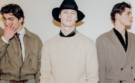 Models wearing Armani clothes in various shades of beige.