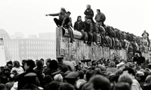 East and West German people celebrate the end of cold war on top of the Berlin Wall, East Berlin, Germany 10 Nov 1989 4384.jpg?width=300&quality=85&auto=forma