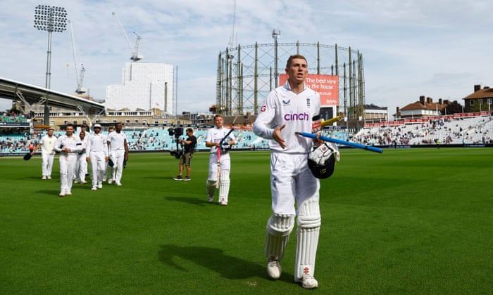 England's Zak Crawley and Ollie Pope walk off the pitch after winning the match and series.