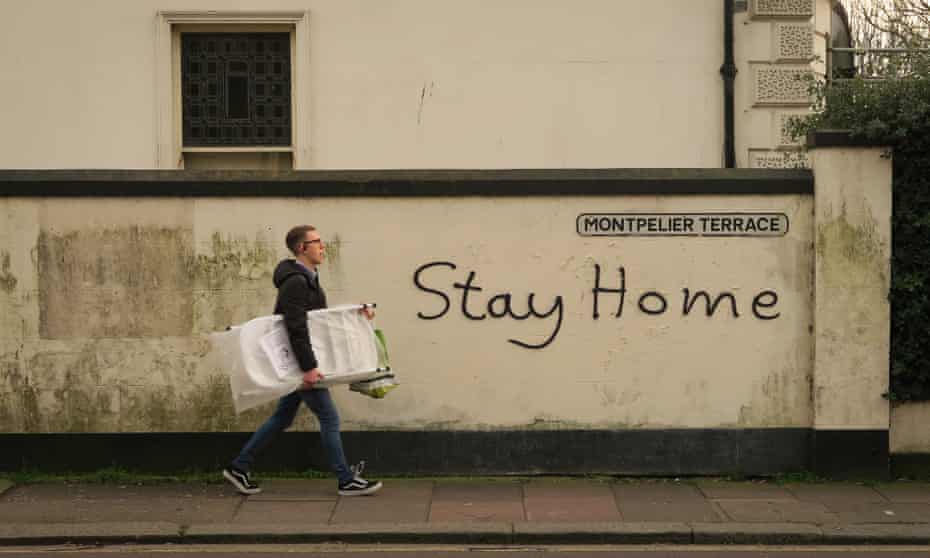 'Stay home' written on a wall in Brighton