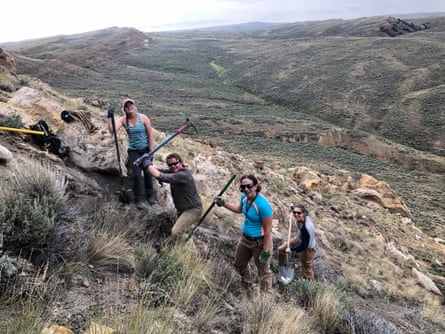 people with shovels on a mountain