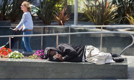 A homeless man sleeps in downtown San Francisco. There are roughly 2,000 people living on the city’s streets.