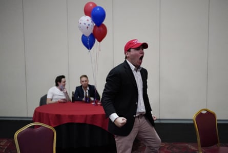 Donald Trump supporter John McGuinness celebrates while watching election returns in favor for Trump at a Republican election night watch party, Tuesday, Nov. 3, 2020, in Las Vegas.