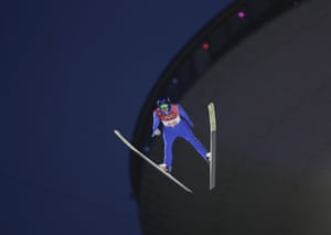 Joergen Graabak, of Norway, jumps during the men’s large hill ski jumping competition in the Nordic combined event.