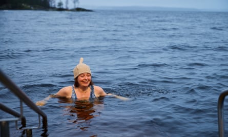 Miranda Bryant smiling while in the lake by Rauhaniemi