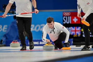 Bruce Mouat curls the stone.