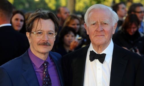 john le carre in black tie with gary oldman purple suit and shirt