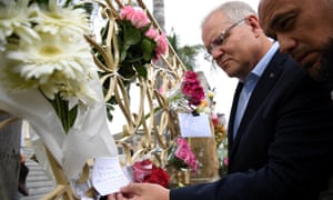 Australian prime minister Scott Morrison (2-R) looks at floral tributes to the victims of the Christchurch terror attack during a visit to the Lakemba Mosque, south west Sydney, Australia, 16 March 2019.