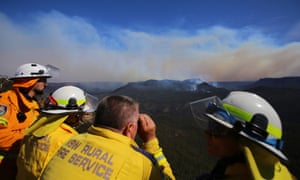 Firefighters from the New South Wales Rural Fire Service monitor the remnants of the Ruined Castle fire in the Jamieson Valley from Echo Point lookout in Katoomba, Blue Mountains.