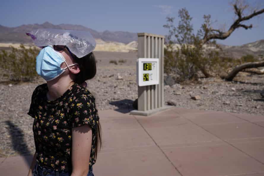 a woman with a bag of ice on her head in Death Valley National Park