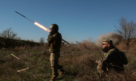Ukrainian soldiers fire a Grad-P rocket on the frontline in the Zaporizhzhia area.