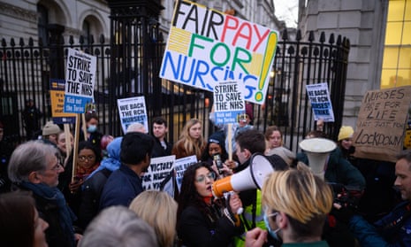 NHS workers and supporters gather outside Downing Street during the second day of strike action by nurses on 20 December