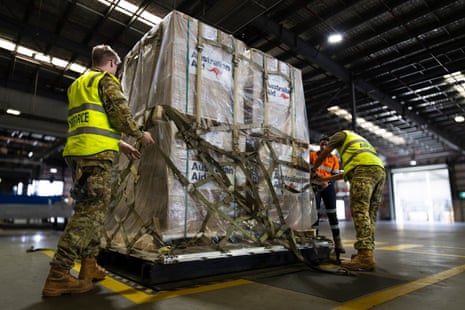Australian aid pallets are loaded at RAAF Base Amberley in response to the catastrophic flooding in Nepal.