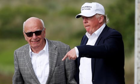Donald Trump speaks to Rupert Murdoch at Trump International Golf Links in Aberdeen, Scotland, in 2016.