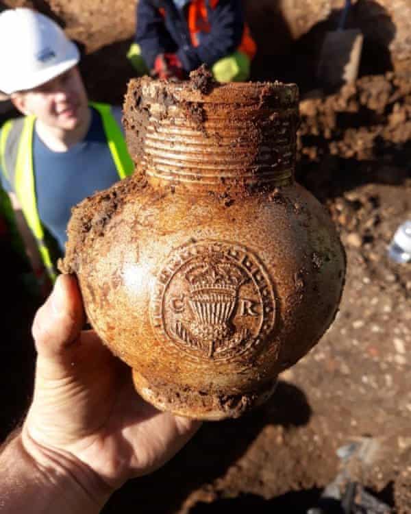 A 17th-century tavern mug with a badge of King Charles II found at the dig site in Whitechapel.