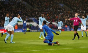 Referee Bobby Madley points to the spot after Demarai Gray went down under Kyle Walker’s challenge.