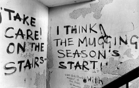 Warning graffiti on a staircase in Hulme Crescents.