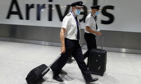 A British Airways flight crew walk through Heathrow
