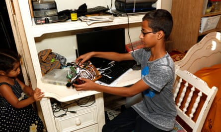 Ahmed Mohamed shows off some of his electronic equipment. He was handcuffed after his school called police over the digital clock he made which ‘looked like a bomb’ to a teacher