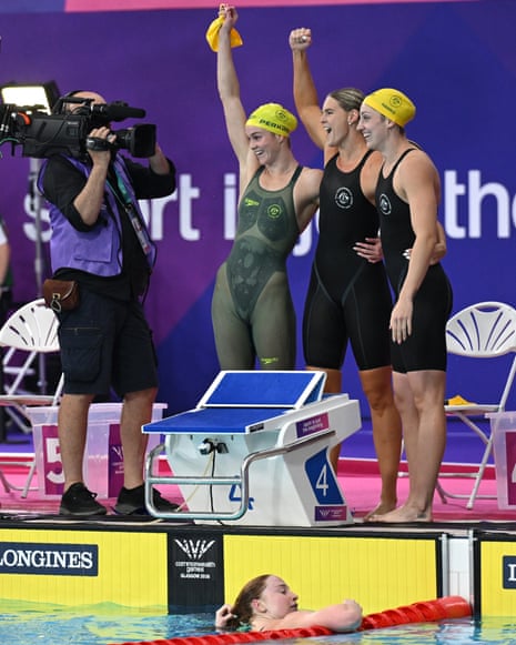 Left to right: Alex Perkins, Shayna Jack, Meg Harris of Australia react after winning the women's 4 x 100m freestyle relay final.