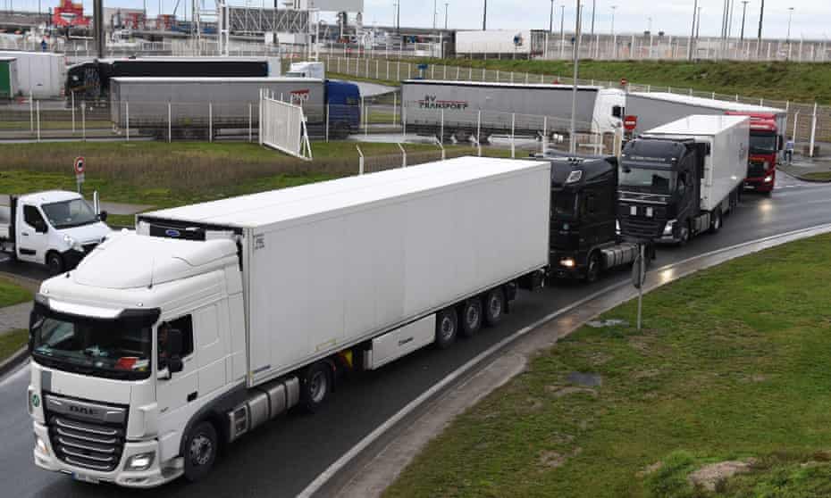 Trucks leave the ferry terminal in Calais as France and Britain reopened cross-border travel.