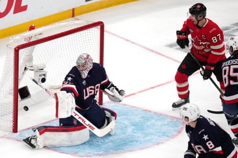 4 Nations Face-Off final: Canada beat USA in sudden-death overtime – as it happened United States goalie Connor Hellebuyck, left, gives up a goal to Canada’s Nathan MacKinnon as Canada’s Sidney Crosby looks on during the first period.
