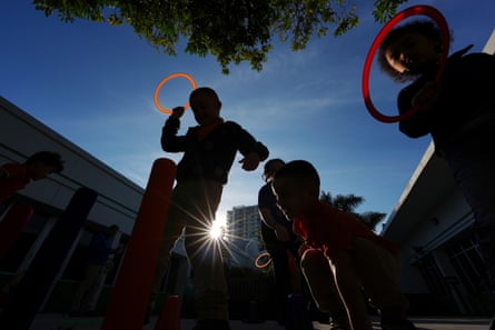 children playing outside in the sun